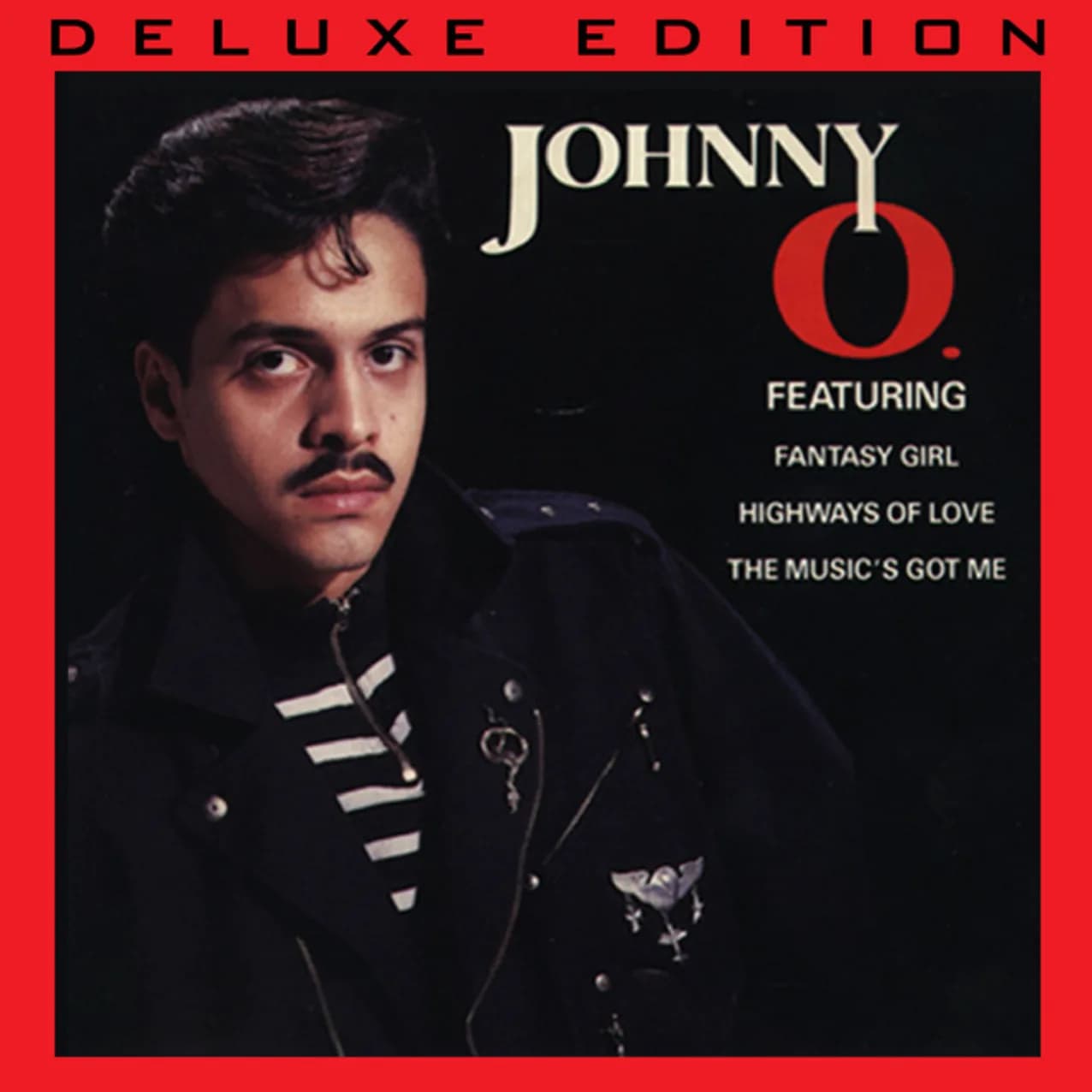 Albumcover Deluxe Edition: Mann in schwarzer Jacke mit weißen Streifen, rote Rahmen, Songtitel Fantasy Girl, Highways of Love, The Music's Got Me